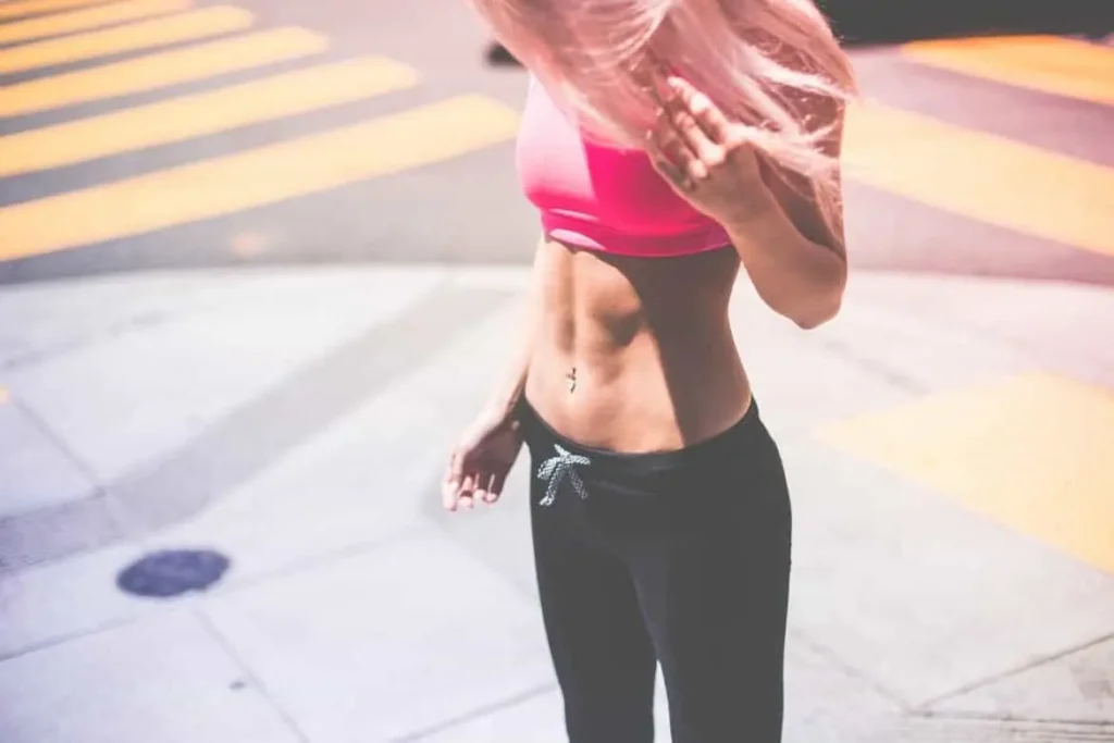 Woman with toned stomach after LA-EMS Body Sculpting Treatment Uxbridge